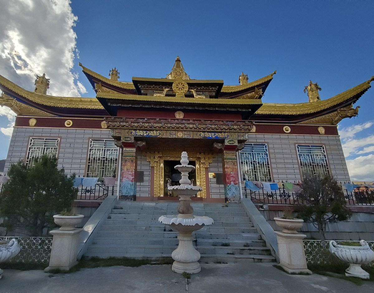The Muya golden stupa, a three-tiered gilded building with five roofs
