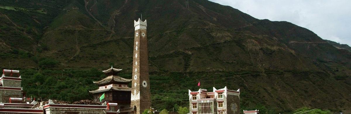 The tower, the scripture hall and the modern village roofs
