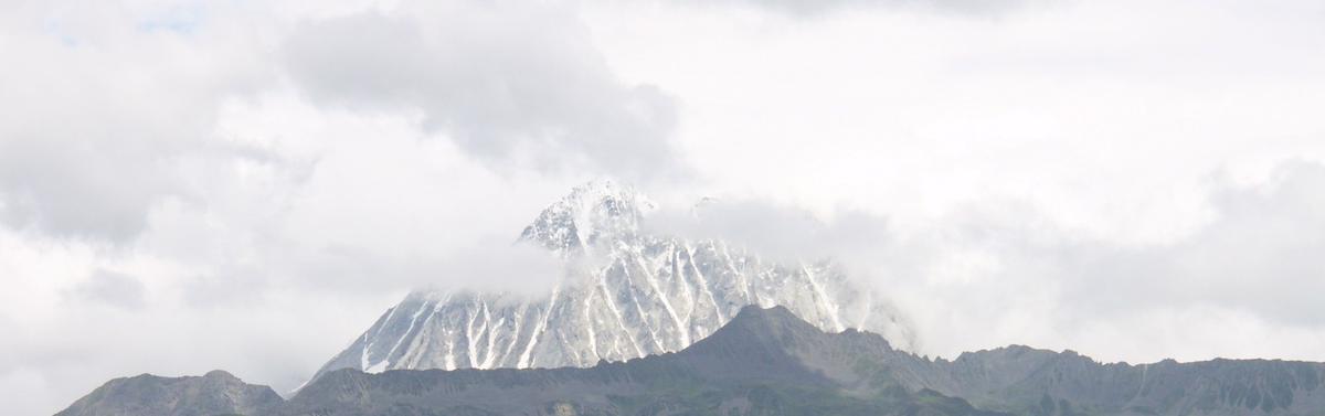 The summit ridge of Yala with cloud lying across it